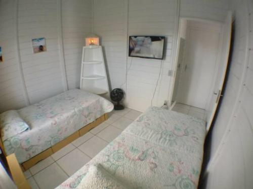Ein Bett oder Betten in einem Zimmer der Unterkunft Casa Azul..,Praia do Sonho.