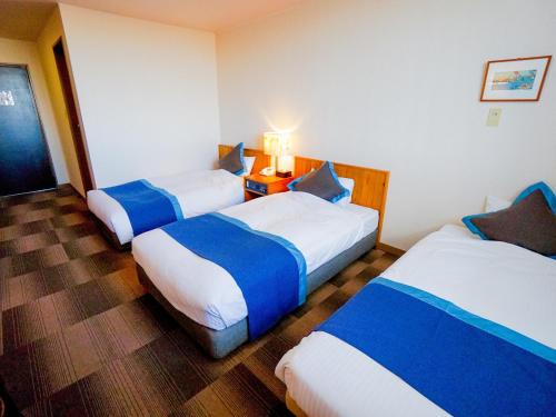 Postel nebo postele na pokoji v ubytování Hotel Area One Ise Inter