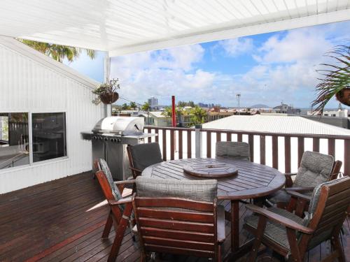 a patio with a table and chairs and a grill at Stay 4 night Pay 3 nights nights only during March 2026 in Alexandra Headland