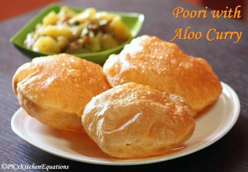 three rolls on a plate with a bowl of food at Hotel Sopan Heights in New Delhi