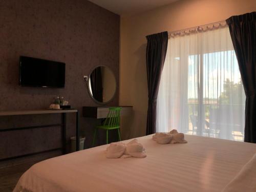 Cama o camas de una habitación en Wings Hotel