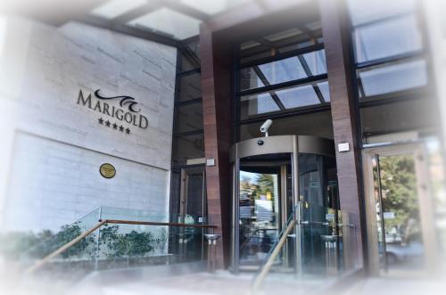 a building with a sign on the side of it at Marigold Thermal & Spa Hotel Bursa in Bursa
