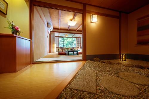 a living room with a large sliding glass door at Harataki in Aizuwakamatsu