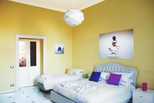 ローマにあるベッド＆ブレックファースト ピアッツァ ヴィットーリオ87のベッドルーム1室(ベッド2台付)が備わります。