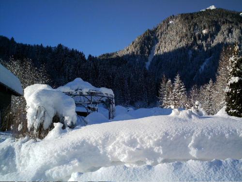 a pile of snow in front of a mountain at Haus Idili in Sankt Gallenkirch