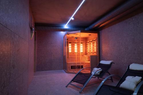 a room with two chairs and a window at Apartmenthotel Oberstdorf in Oberstdorf