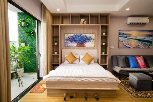 Giường trong phòng chung tại Căn hộ TMS Pullman cao cấp Studio có ban công view biển - Golden Wave Homestay