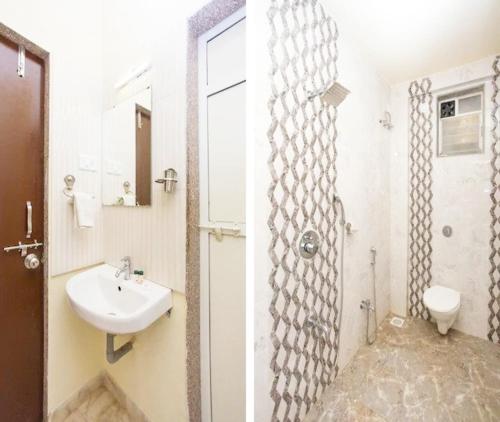 a bathroom with a sink and a toilet at Harmony Palace in Mahabaleshwar