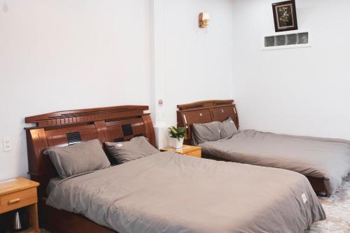 Postel nebo postele na pokoji v ubytování Rot Homestay