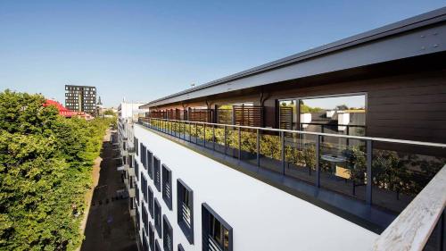 a balcony of a building with plants on it at Hestia Hotel Kentmanni in Tallinn