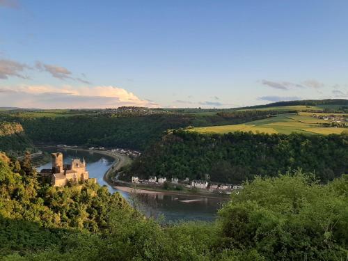 an aerial view of a river and a castle at Kaiser - Ferienwohnungen Dreiburgenblick in Patersberg