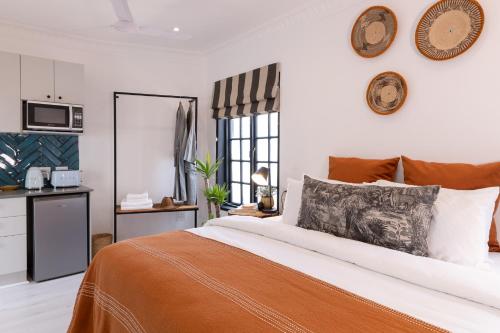 A bed or beds in a room at Thelma & You