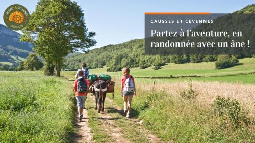 a couple of people and a horse on a trail at ISPAEVA in Ispagnac