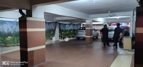 a group of people standing in a parking garage at Dwaraka Inn in Visakhapatnam