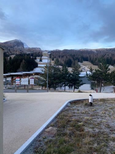 a person standing on the side of a road at Studio les toits du Devoluy in Le Dévoluy