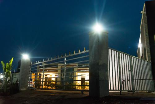 a building with two lights on top of it at night at AVISHA TOWN HOTEL in Kigali