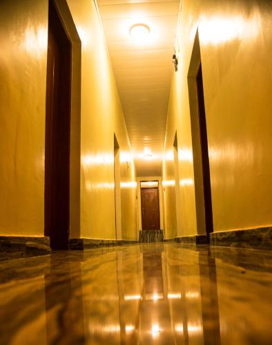 an empty hallway with a door in a building at AVISHA TOWN HOTEL in Kigali