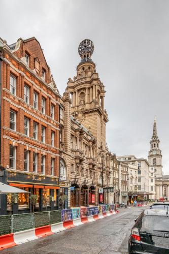 an old building on a street in a city at Stay Kula London - Covent Garden St Martin's Lane in London