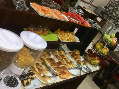 a buffet with a lot of different types of food at Hotel Waldorf in Buenos Aires