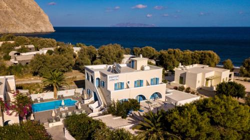 an aerial view of a villa with the ocean in the background at Stelios Place in Perissa
