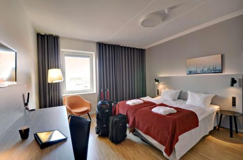 Säng eller sängar i ett rum på Scandic Aarhus City