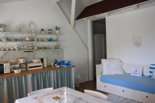 Postel nebo postele na pokoji v ubytování Bacchus Apartman - Borbarlang, Badacsony