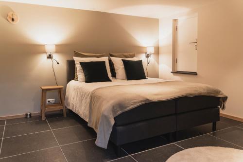 Postel nebo postele na pokoji v ubytování Vakantie-appartement Oppe Donck met sauna