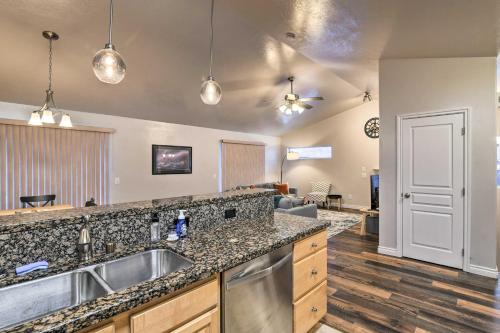 a kitchen with a sink and a counter top at Cozy Anchorage Townhome Less Than Half Mile to Jewel Lake! in Anchorage