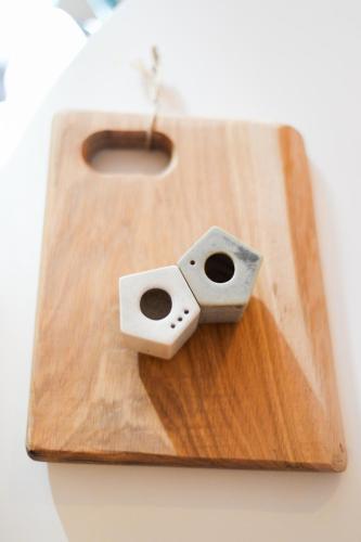a wooden cutting board with a block on it at Cabin & Apartment Kopaonik in Kopaonik
