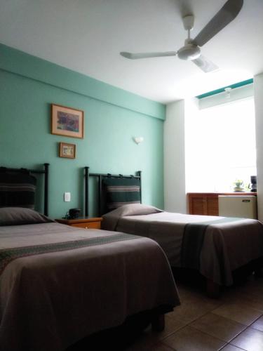 Cama o camas de una habitación en Posada de los Angeles