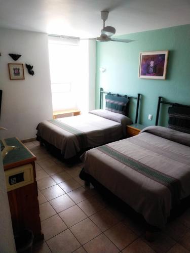 Cama o camas de una habitación en Posada de los Angeles