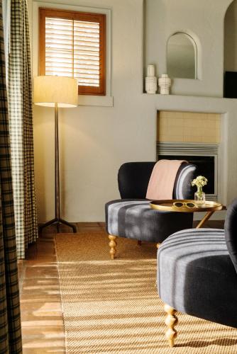 a living room with a couch and a table at Palihouse Santa Barbara in Santa Barbara
