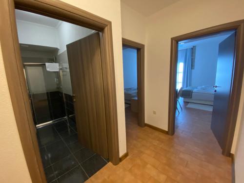 a hallway with an open door to a room at Eco-selo Grabovica in Grabovica