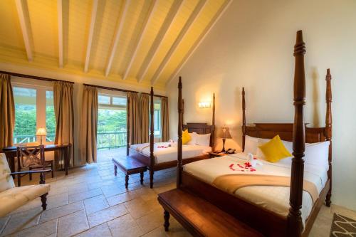 Voodi või voodid majutusasutuse Rosalie Bay Eco Resort & Spa toas