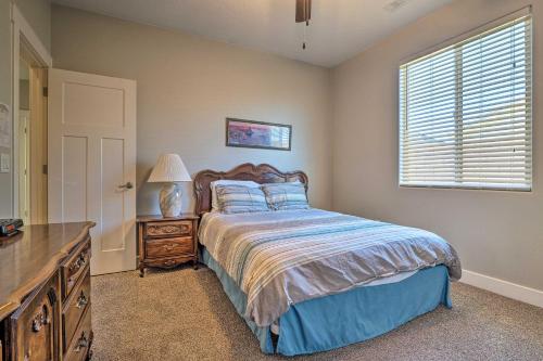 a bedroom with a bed and a dresser and a window at Adventure Bound Home with Pickleball, Hot Tub and More in Hurricane