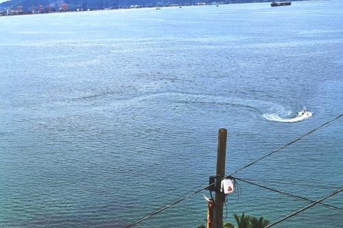 a boat in a body of water at 64 Peninsula del Capitan in Manzanillo