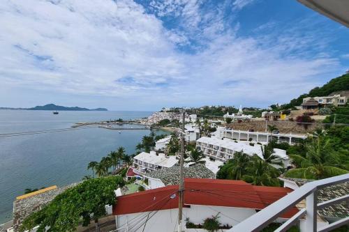 a view of the ocean from a balcony at 64 Peninsula del Capitan in Manzanillo
