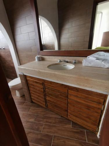 a bathroom with a sink and a mirror at 64 Peninsula del Capitan in Manzanillo