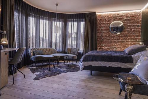 Postel nebo postele na pokoji v ubytování Hotel ONIRO - Luxury Rooms & Wellness Suites