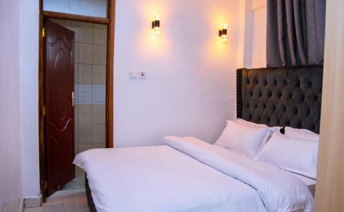 Letto o letti in una camera di Executive Two & Three Bedroom Suites
