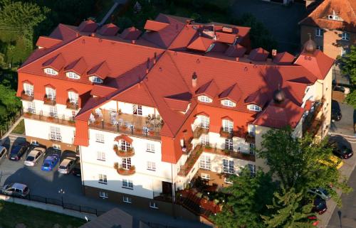 an overhead view of a large building with a red roof at Hotel Adam & Spa in Kudowa-Zdrój