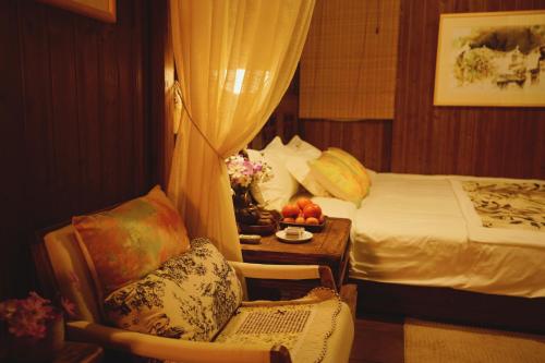 WuYuan QiYe YanXiang Guesthouseにあるベッド
