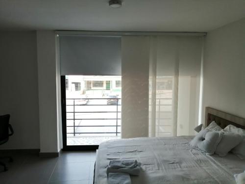 Postel nebo postele na pokoji v ubytování Berilo Deluxe Apartahotel