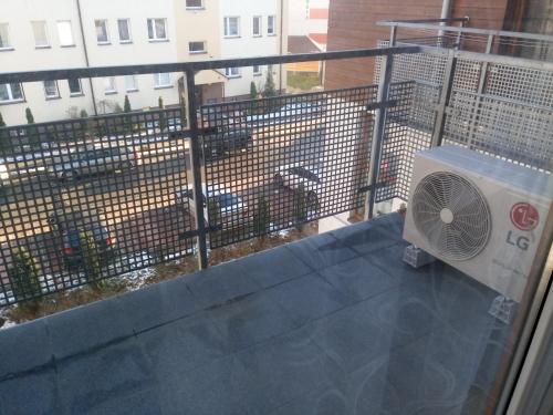 a room with a fan on a balcony at Chata Mego Brata in Limanowa
