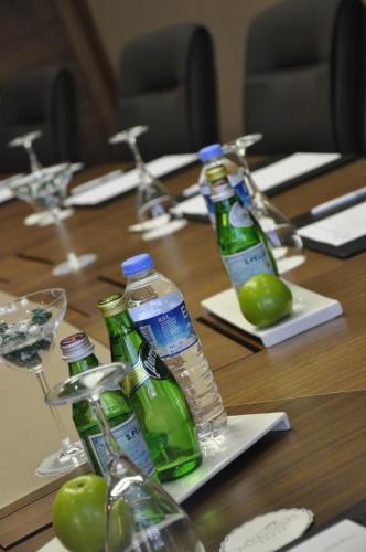 a table with bottles of water and glasses on them at Marigold Thermal & Spa Hotel Bursa in Bursa