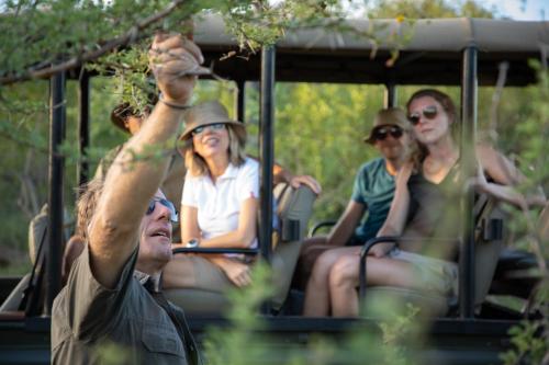 a group of people riding in a trolley at Parsons Hilltop Safari Camp in Balule Game Reserve