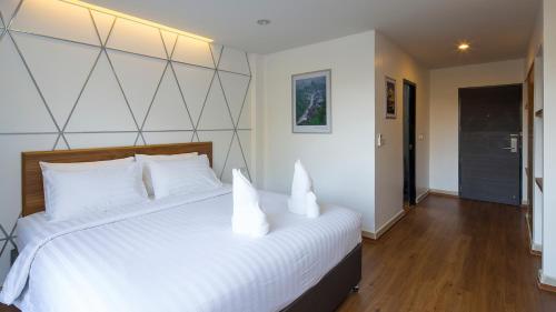 Postel nebo postele na pokoji v ubytování ARAYA HOTEL