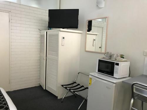 Kuchyň nebo kuchyňský kout v ubytování Coffs Shearwater Motel