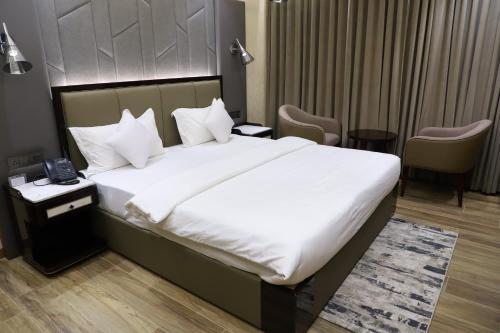 Una cama o camas en una habitación de Hotel Palazzo Prime