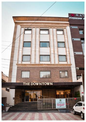 a building with the downtown sign on it at THE DOWNTOWN in Kānpur
